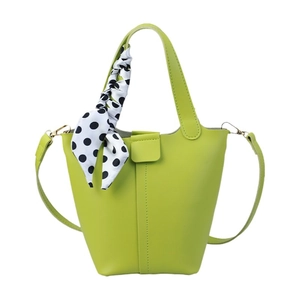 Fruit green bucket bag with a polka dot silk scarf handle and adjustable shoulder strap