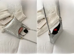 Silver crocodile texture tote bag showing interior storage space and metal buckle details