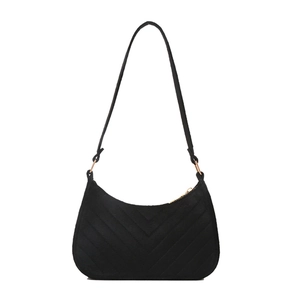 Minimalist black crescent shoulder bag with V-shaped quilting and golden rings