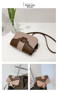 Detail view of khaki and brown color-blocked shoulder bag with square buckle and gold hardware