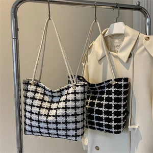 Classic black and white checkered tweed tote bag with woven rope handles for daily commute