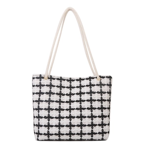 Classic checkered tote bag with woven pattern and durable cotton rope handles for women
