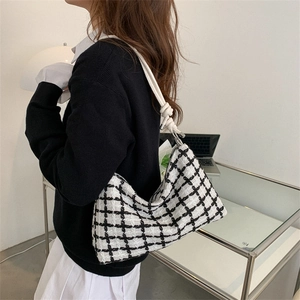 Chic black and white plaid tweed underarm tote bag with a white knotted shoulder strap