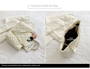 Dettaglio dell'interno di una borsa tote trapuntata bianca con ampio scomparto principale