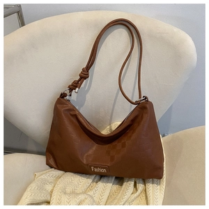 Detailed view of brown PU leather shoulder bag with checkerboard embossing and Fashion plate