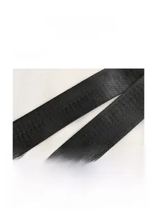 Close-up of high-density black nylon woven shoulder strap with twill texture detail