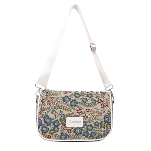 Vintage floral tapestry shoulder bag with adjustable strap and fashion label detail