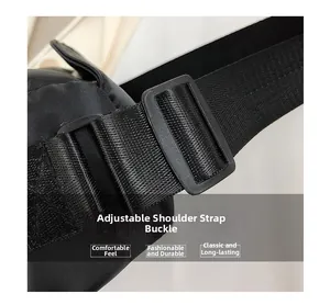 Detail view of the adjustable plastic buckle and durable nylon strap on the shoulder bag