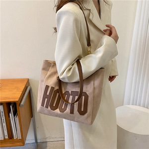 Large beige tote bag with HOOTO letter patch and brown straps for casual daily commuting