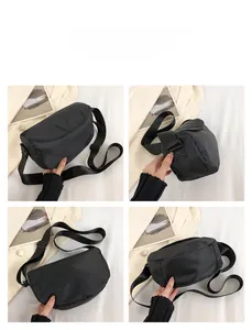 Multi-angle views of a black nylon crossbody bag showing the minimalist crescent shape