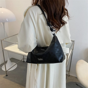 Fashionable black shoulder bag featuring checkered texture and cylindrical rope strap