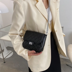 Classic black quilted crossbody bag with silver chain strap and metal lock closure