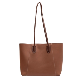 Classic brown tote bag with white contrast stitching and minimalist retro design