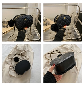 Detailed views of a black quilted leather oval bag with gold camellia clasp and chain