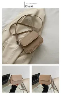 Detail of khaki crossbody bag featuring quilted diamond pattern and logo printing