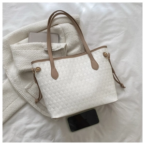 Large capacity quilted tote bag in cream white with phone for size reference