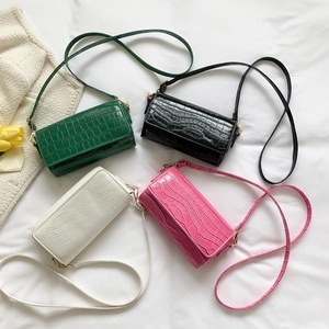 Minimalist faux crocodile leather baguette bags in green, black, white, and pink colors