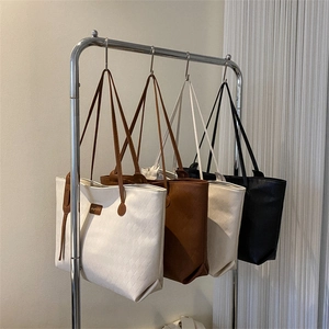 Minimalist large-capacity woven tote bags in cream, brown, apricot, and black colors