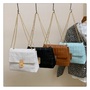 Quilted chain shoulder bags in white, black, brown, and light blue with gold locks
