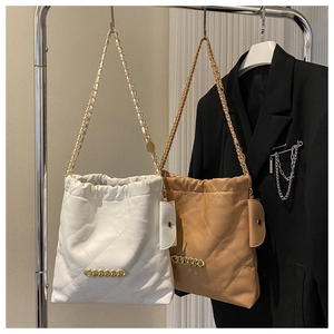 Quilted leather shoulder bags in white and brown with chunky gold chain and mini pouches