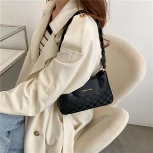 Minimalist black checkered leather shoulder bag with woven strap and gold fashion logo