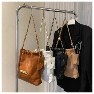 Detailed set of four quilted leather chain shoulder bags with mini pouches on hangers
