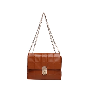 Classic brown quilted shoulder bag with gold chain strap and turn-lock closure on white background