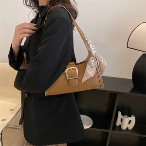 Brown crocodile embossed underarm bag with gold buckle and decorative silk scarf