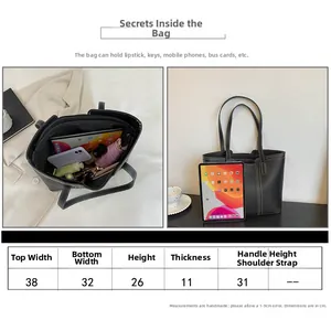 Size chart and capacity detail of minimalist black tote bag with white contrast stitching