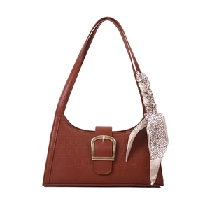 Brown crocodile pattern shoulder bag with golden horseshoe buckle and silk scarf detail
