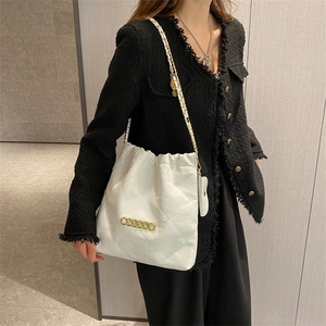 White quilted drawstring shoulder bag with gold chain and trendy bucket style