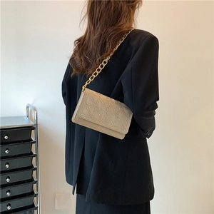 Chic beige velvet shoulder bag with stud geometry and chunky gold chain strap