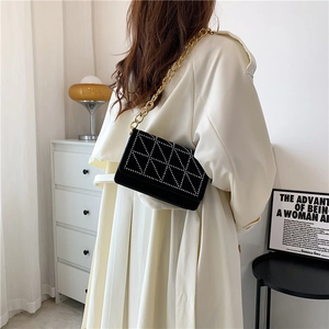 Fashionable black velvet shoulder bag with rhinestone geometric patterns and gold chain