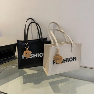 Chic autumn tote bags in black and white with FASHION print and cute bear charms