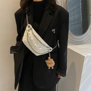White quilted waist bag for women with dual chain straps and cute plush pendant