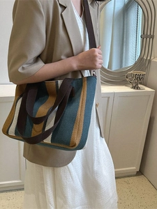 Large striped canvas tote bag in blue and yellow with brown straps for women's fashion