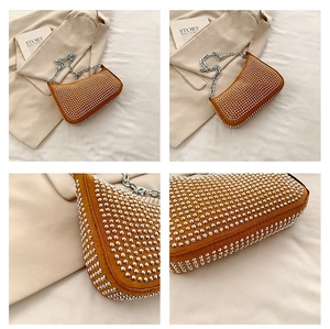 Detailed views of orange suede underarm bag with silver studs and chunky chain strap