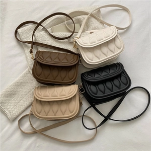 Vintage quilted shoulder bags in white brown black and apricot colors with wave pattern