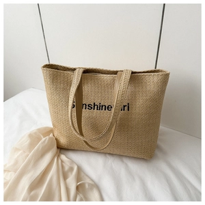 Close-up of Sunshine Girl printed lettering on beige woven canvas tote bag