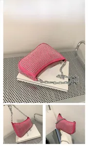 Detail of pink Y2K shoulder bag with silver rivets and heavy metal chain strap