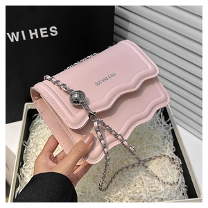 Pink chain shoulder bag with scalloped edge detail and silver metal ball charm