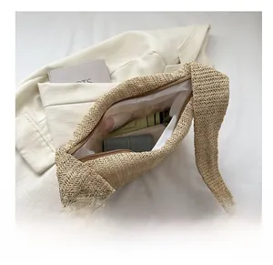 Close-up of a straw tote bag interior showing spacious storage for daily items
