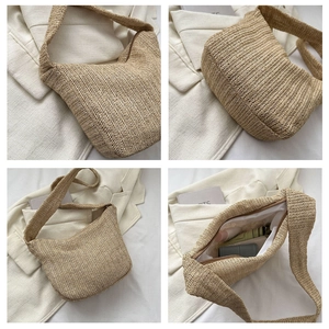 Detail view of large straw hobo bag showing spacious interior and woven texture