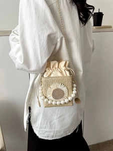 Chic woven straw square bag with 3D floral accent, pearl handle and gold chain strap