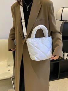 White quilted puffer crossbody bag with top handle and adjustable strap for casual wear