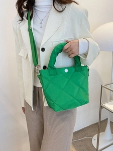 Bright green quilted nylon crossbody bag with ruffled texture and top handle for women