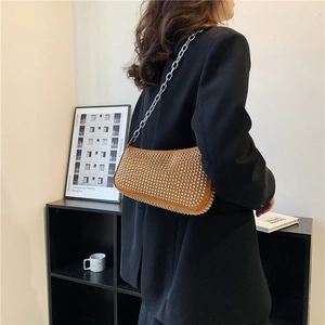 Brown leather underarm bag with silver rivets and metal chain strap for women