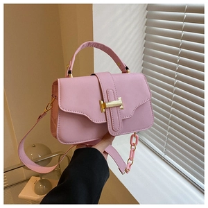 Pink crossbody square bag with golden H clasp and smooth matte finish detail