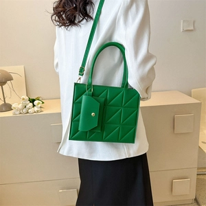 Bright green quilted handbag with matching coin purse and adjustable strap for women