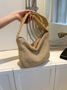 Large beige woven straw tote bag with chevron pattern and shoulder strap for women